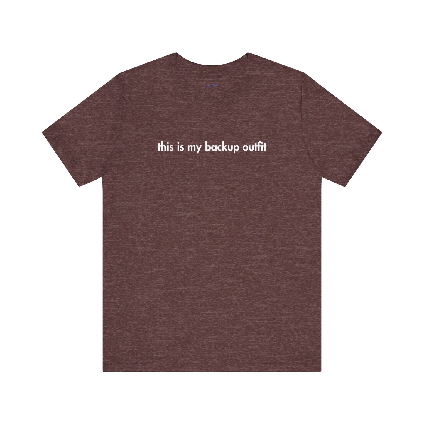 Brown t-shirt with white text 'this is my backup outfit' on a white background