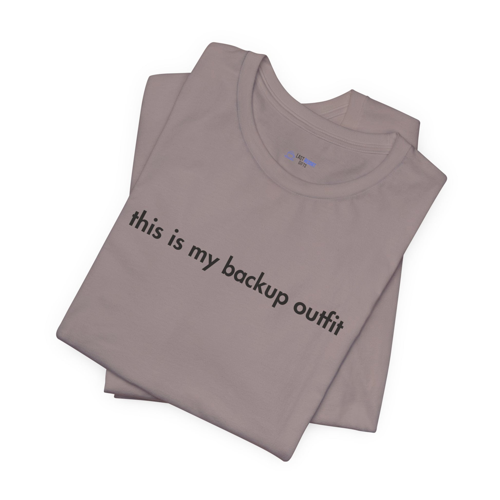 Folded gray t-shirt with 'this is my backup outfit' text on a white background