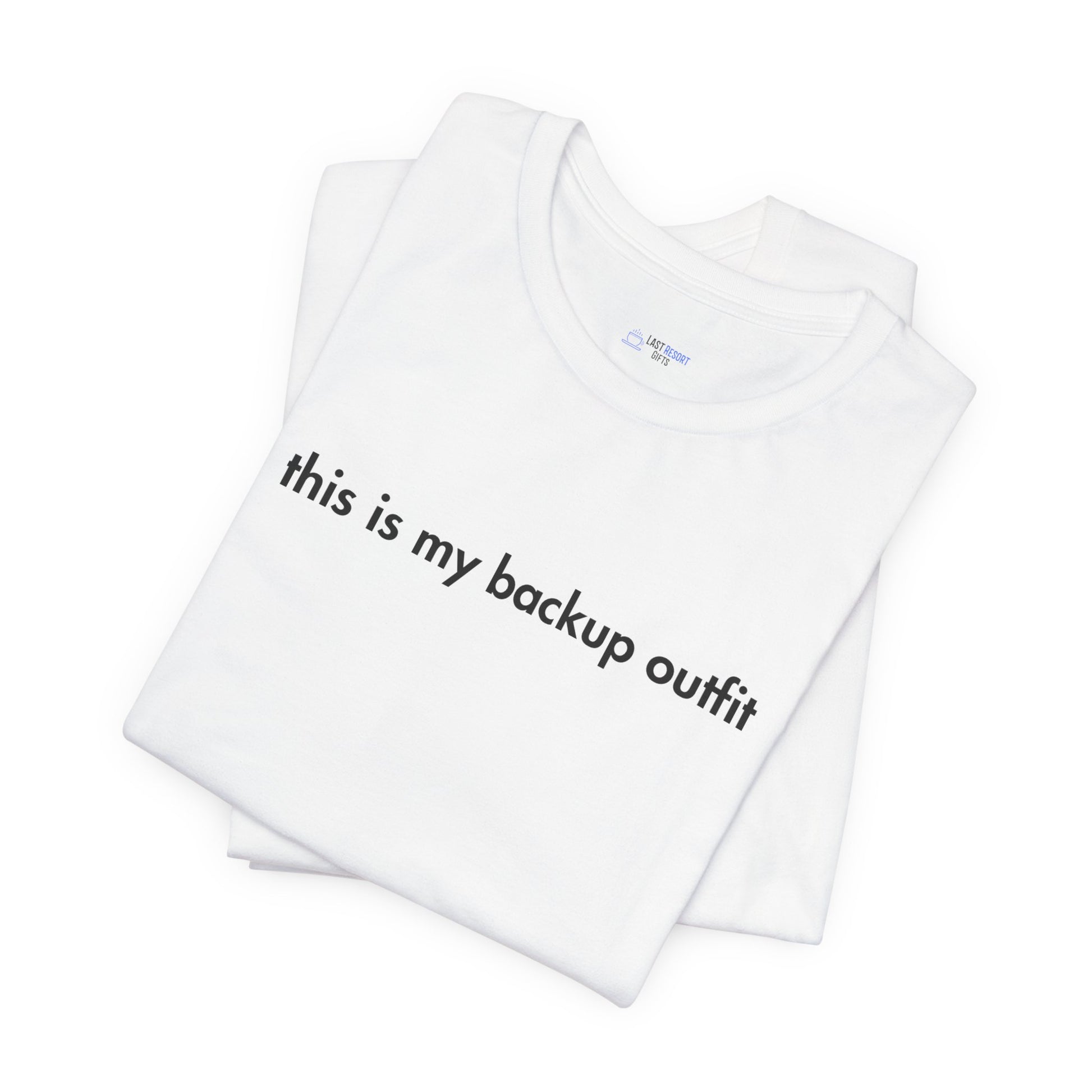 White t-shirt with text 'this is my backup outfit' on a white background